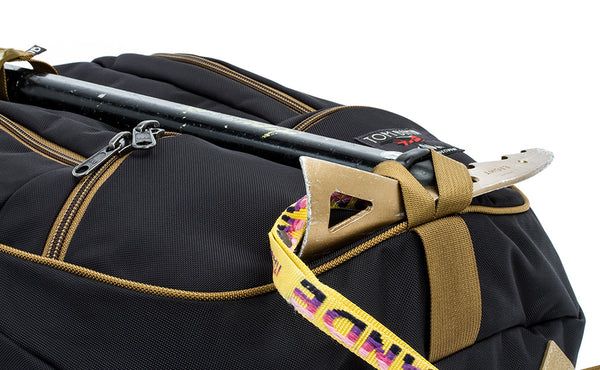 A close shot of an ice axe lashed to the face of a Guide's Edition Synapse 25 using the front lashpoint and ice axe loop.